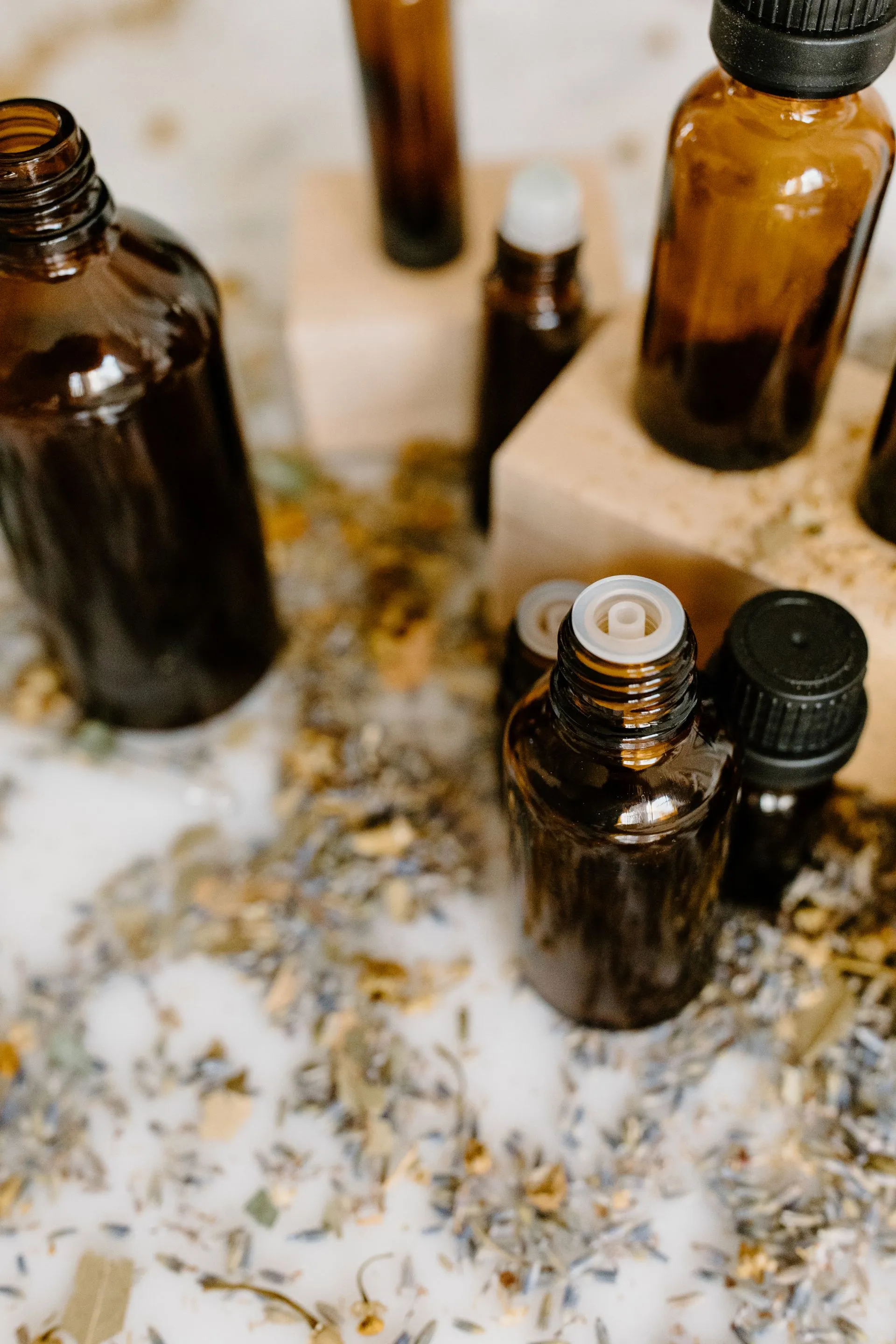 Evans Luxury Scents perfume bottles lit warmly against a dark background